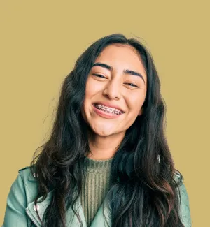 Child with braces smiling